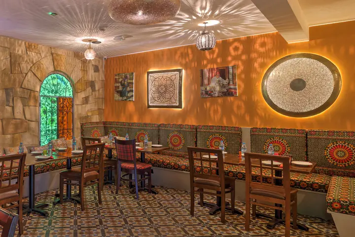 A dining room at Tarboush Watford laid for a group