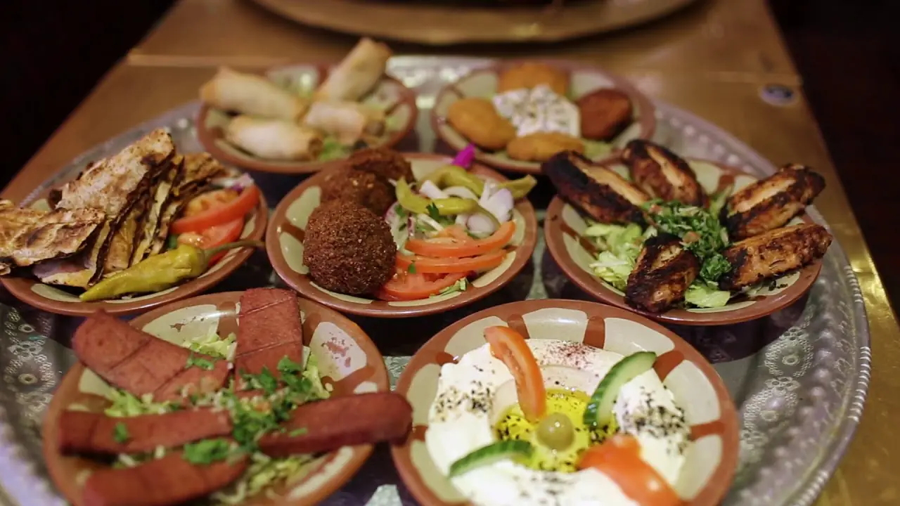 A chef carving shawarma at Tarboush